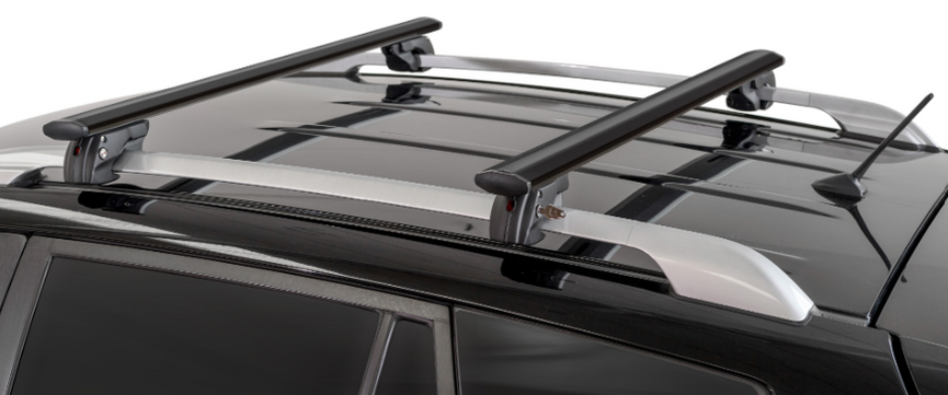 two black roof bars mounted on a vehicle with original bars