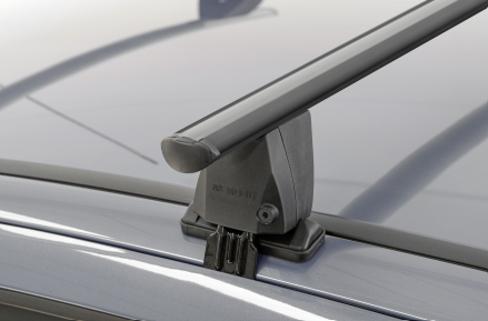 black roof bar with clamp fastening on a dark vehicle