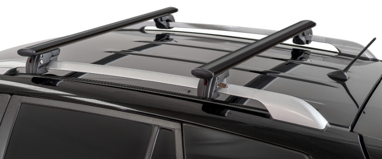 two oval roof racks mounted on a dark vehicle