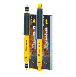 Two black and yellow rubber shock absorbers