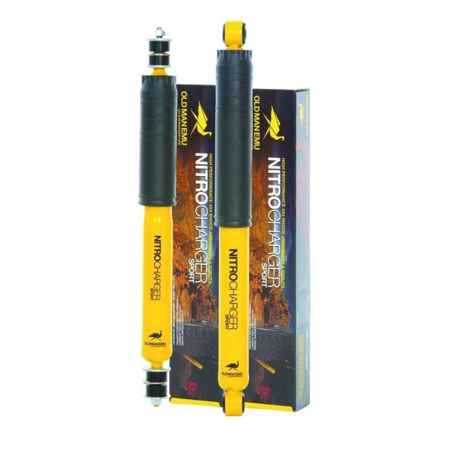 Two yellow and black shock absorbers, standing upright