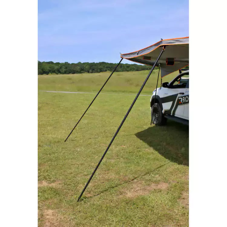 stakes of a Awning Rockalu  unfolded in the grass