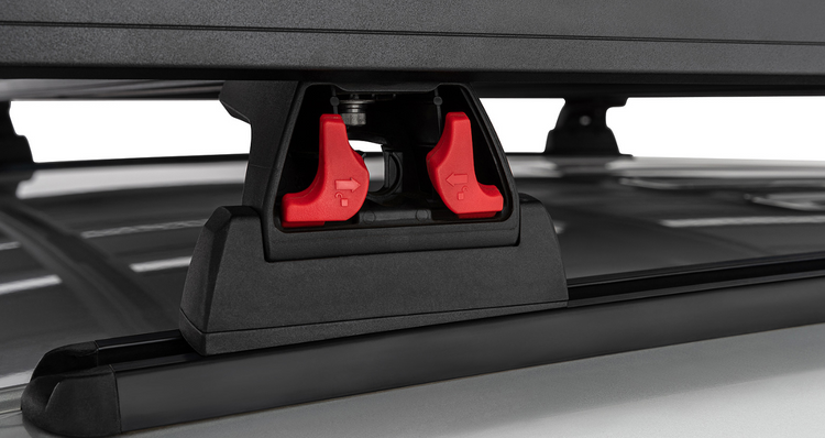 close-up view of the quick-release foot, which unlocks with two red buttons