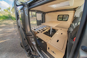 van interior with bed and table layout