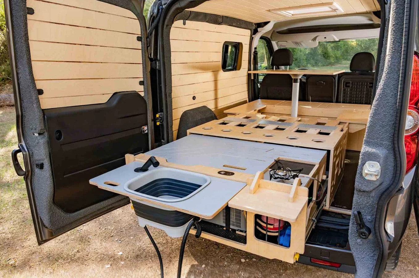 vehicle interior with wooden fittings and kitchen area