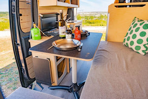 interior of a van with kitchen and bed area