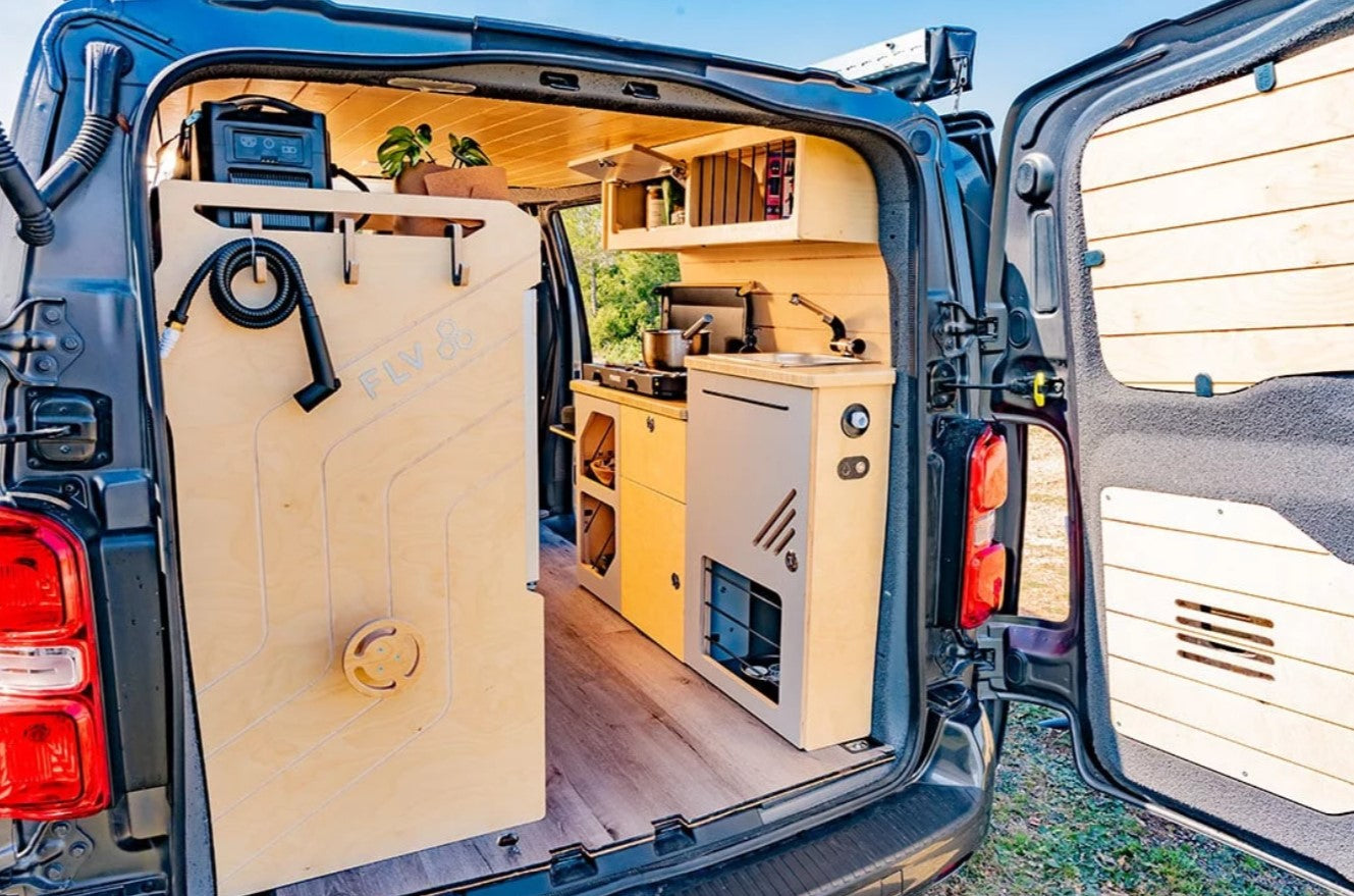 interior of a van with kitchen area and sink