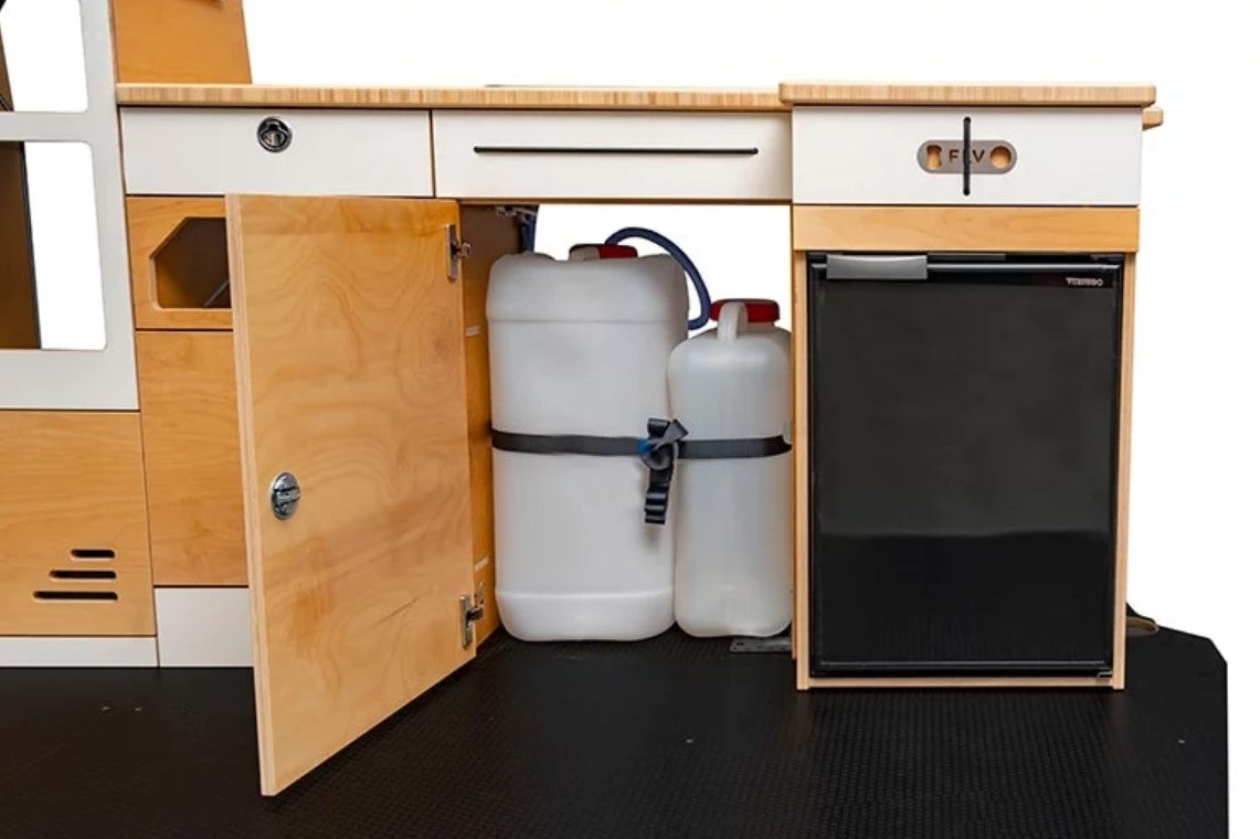 Two water jerry cans in a cabinet in the VAN