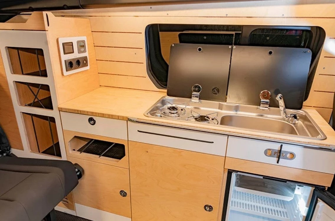 Interior of a VAN with kitchen module and sink area