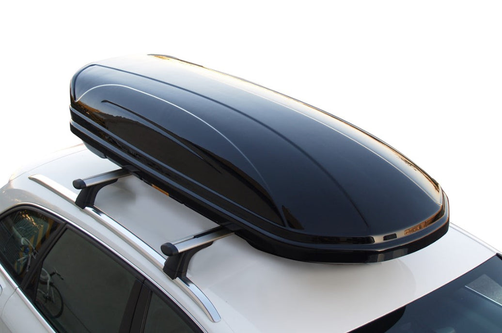 high-gloss black roof box on a white roof