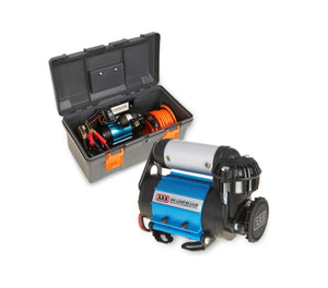 ARB compressor in front of a case with hose