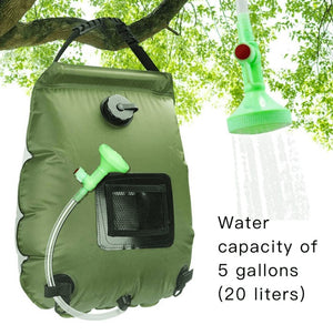 green shower bag hanging from a tree