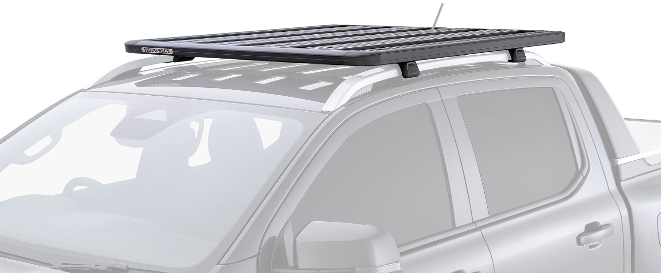 black roof rack featured on a blurred pickup