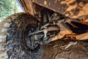 MT64 shock absorber on vehicle in mud