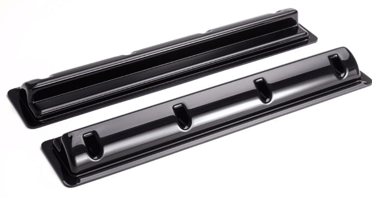 two black plastic rods on a white background