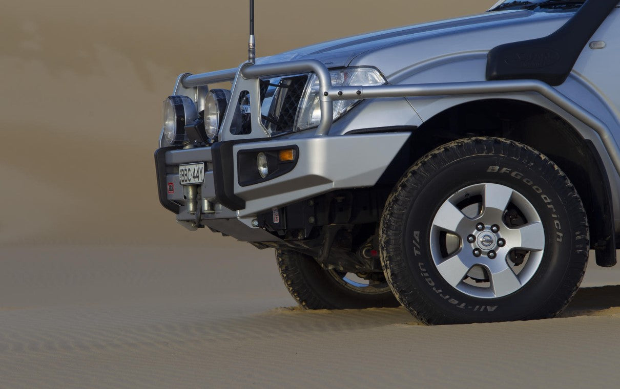 Left view of a Nissan 4x4 in the desert with ARB protection