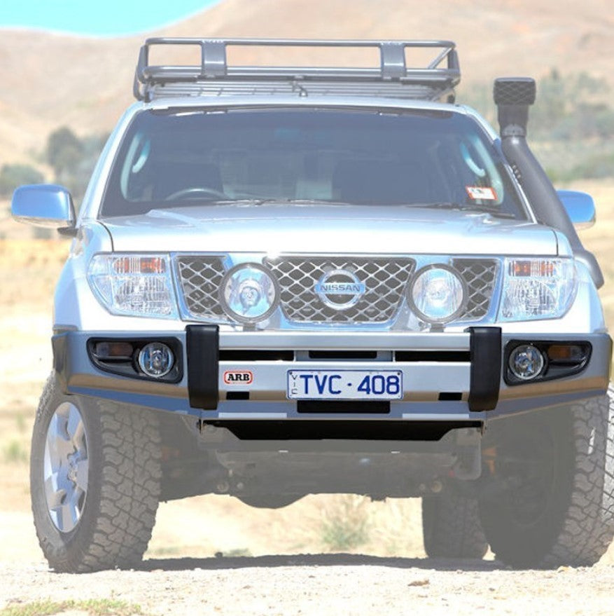 Nissan Pathfinder on a dry road, with arb bumper highlighted
