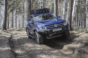 Volkswagen Amarok Blue equipped for off-roading in the woods