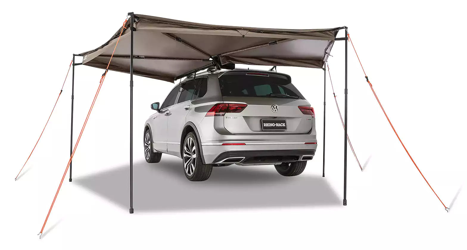 Volkswagen SUV parked with small awning unfolded on left side