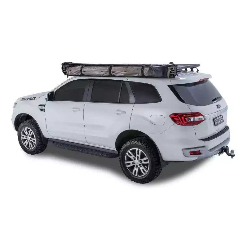 Awning being deployed on a white SUV