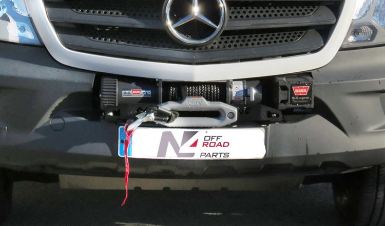 front of a mercedes with a winch warn on it