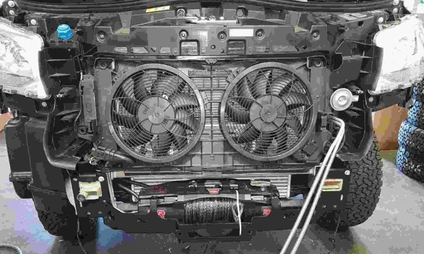front of a vehicle with two fans above a winch