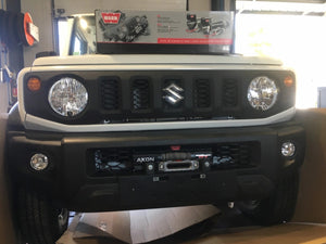 Front of a suzuki jimny with winch warn behind the bumper