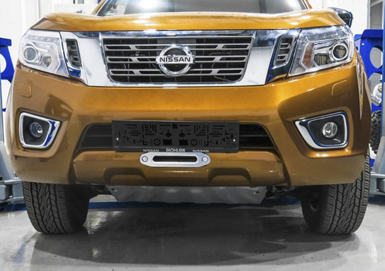 front end of a mustard-colored nissan navara