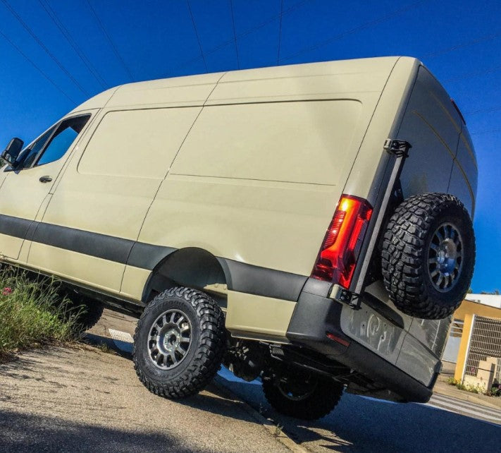 Green Mercedes Sprinter with left rear wheel carrier