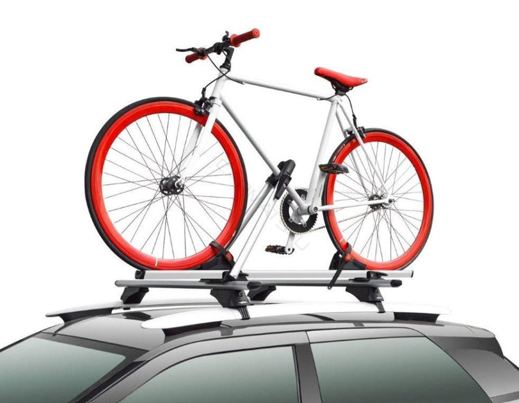 Red and white bike on a Bike Rack on a car