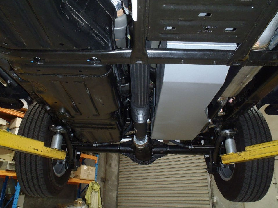 Under a clean vehicle on a bridge with an additional grey tank