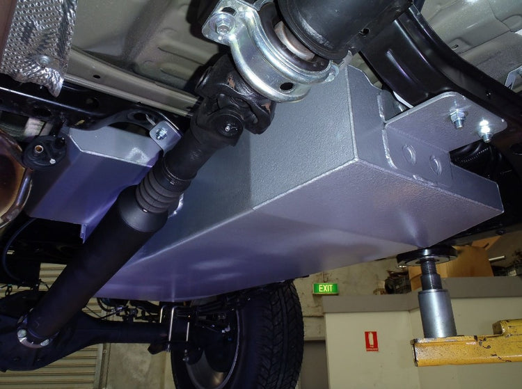 view from under a vehicle with an additional metal tank