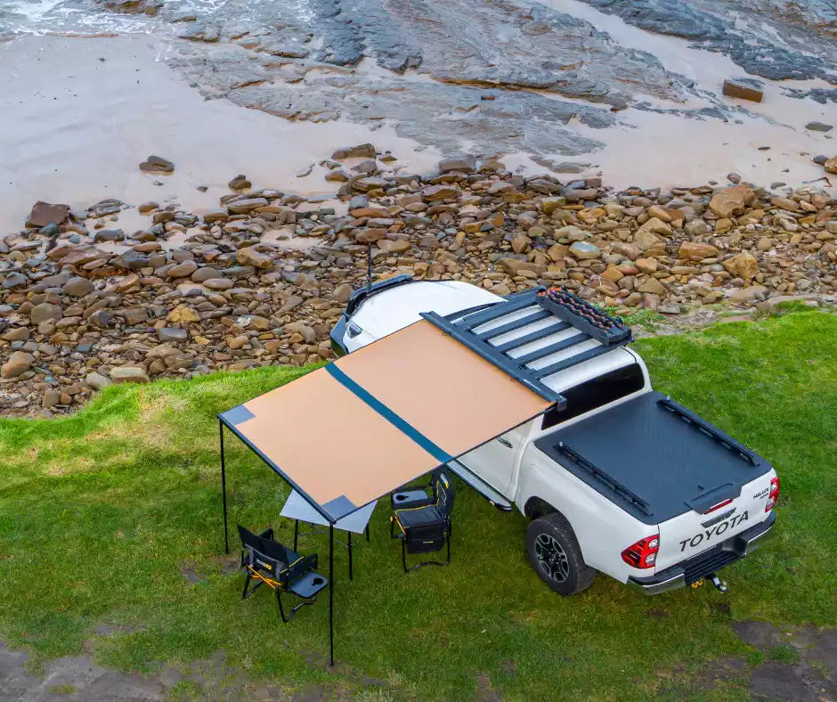 Pick-up parked in bivouac with an unfolded Awning ARB