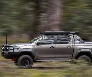 Brown pick-up equipped with bumper and Awning