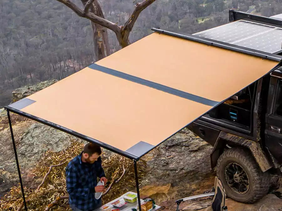 Awning ARB side guard protecting a man in a shirt from the rain