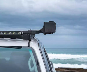 Roof rack on vehicle with LED bar and Awning ARB