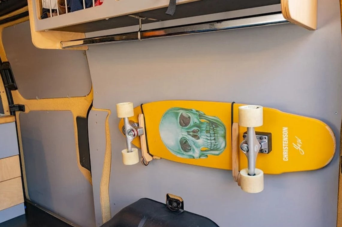 Skateboard on the wall of a van