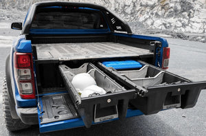 rear view of a blue Ford with a double decked drawer open