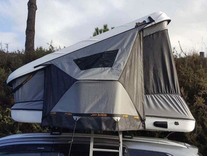 Roof tent james baroud grey open on a car