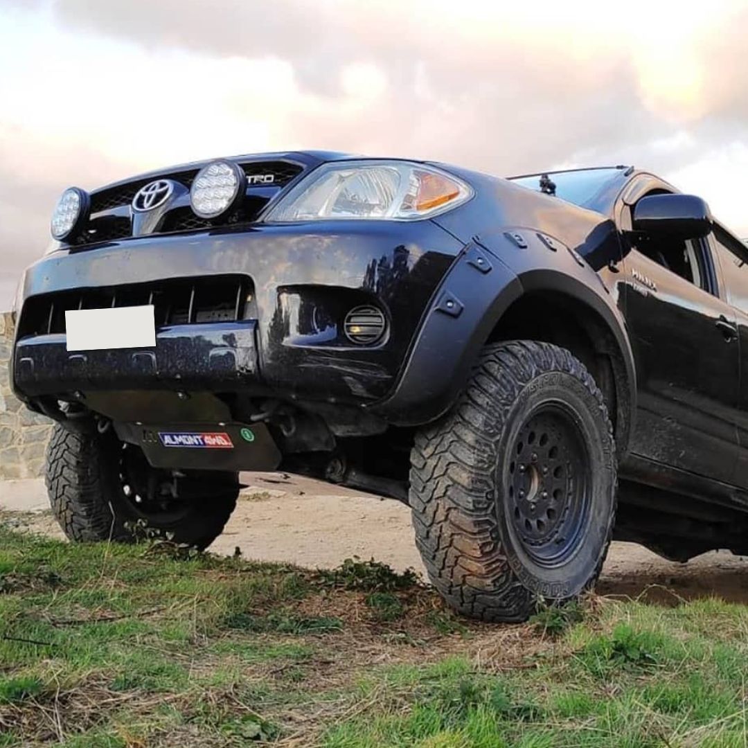 Hilux Black on grass with lower guards