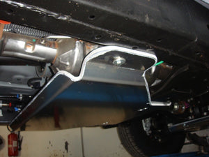 transfer case shielding mounted on a vehicle in a garage