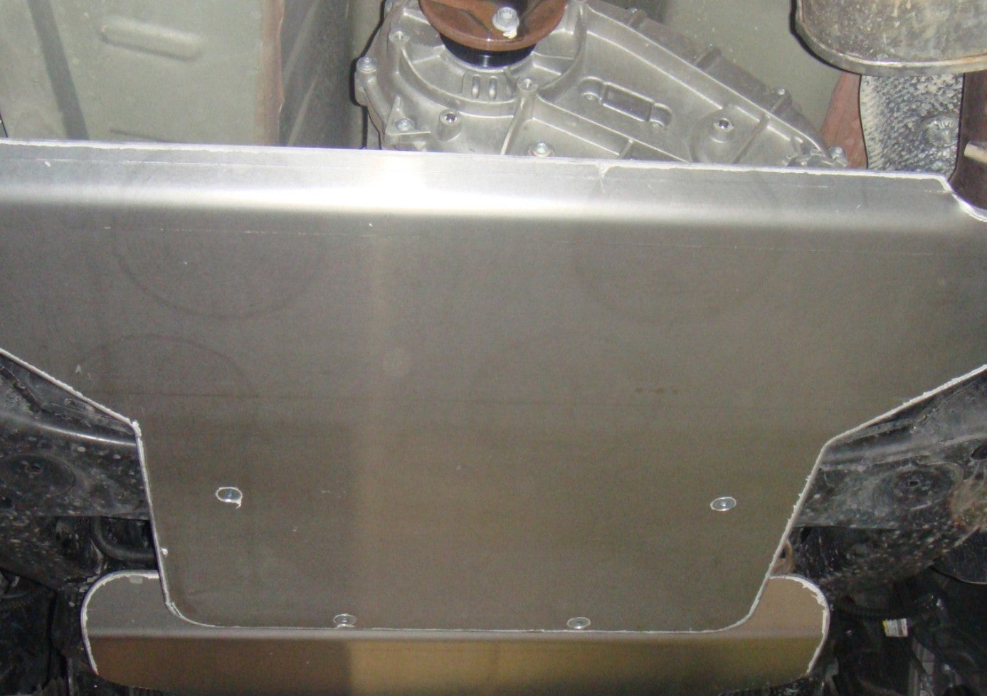 view of an aluminum guard mounted under the vehicle