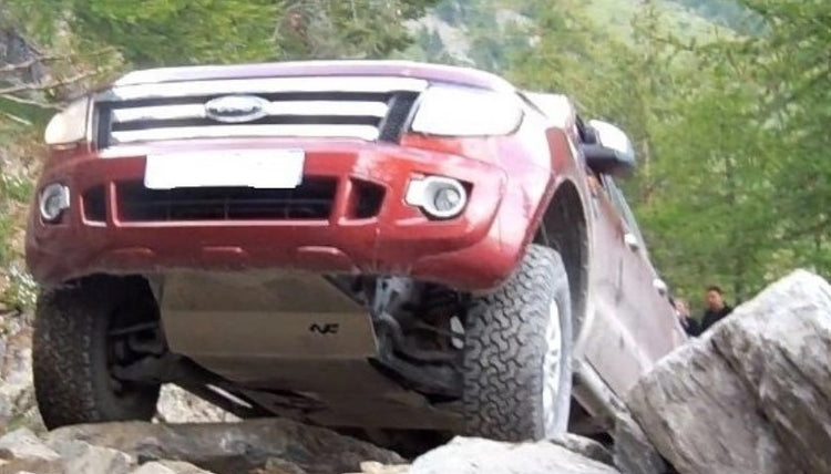 ford ranger red on rocks with grey engine shielding