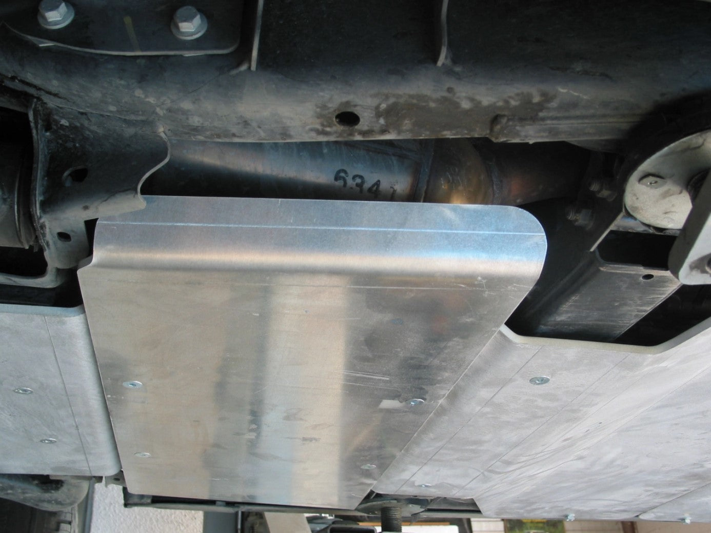 aluminium protective ski attached to the underside of a vehicle between two