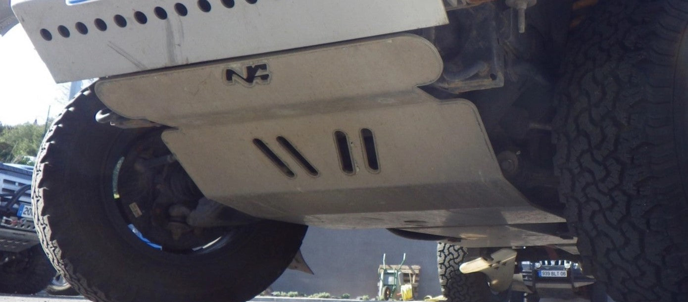 metal front skid mounted under a vehicle