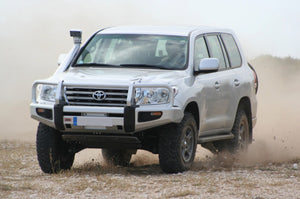 land cruiser 200 in action on the grass with a snorkel