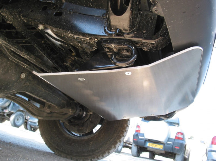 view of a vehicle from below with an aluminum plate to protect the front end