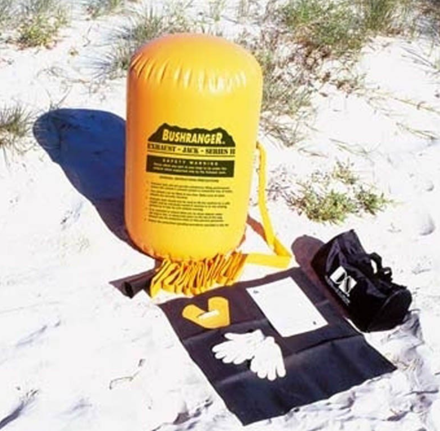 yellow hi lift bushranger jack inflated and positioned on sand