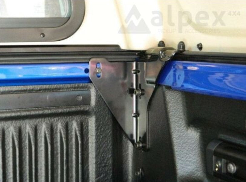 metal mounting against a Bed Truck pick-up for Canopy Hardtop