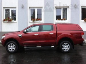 side view of a red pickup with a Canopy Hardtop on top